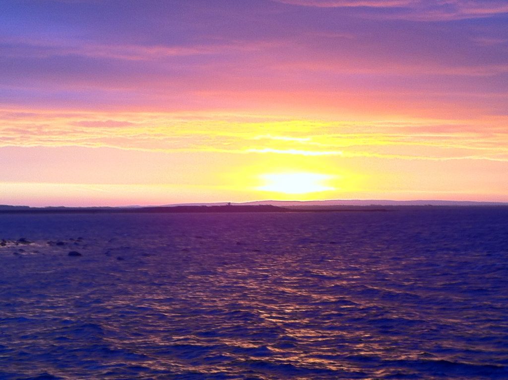 Sunrise over Galway Bay and the Clare hills, seen from Salthill